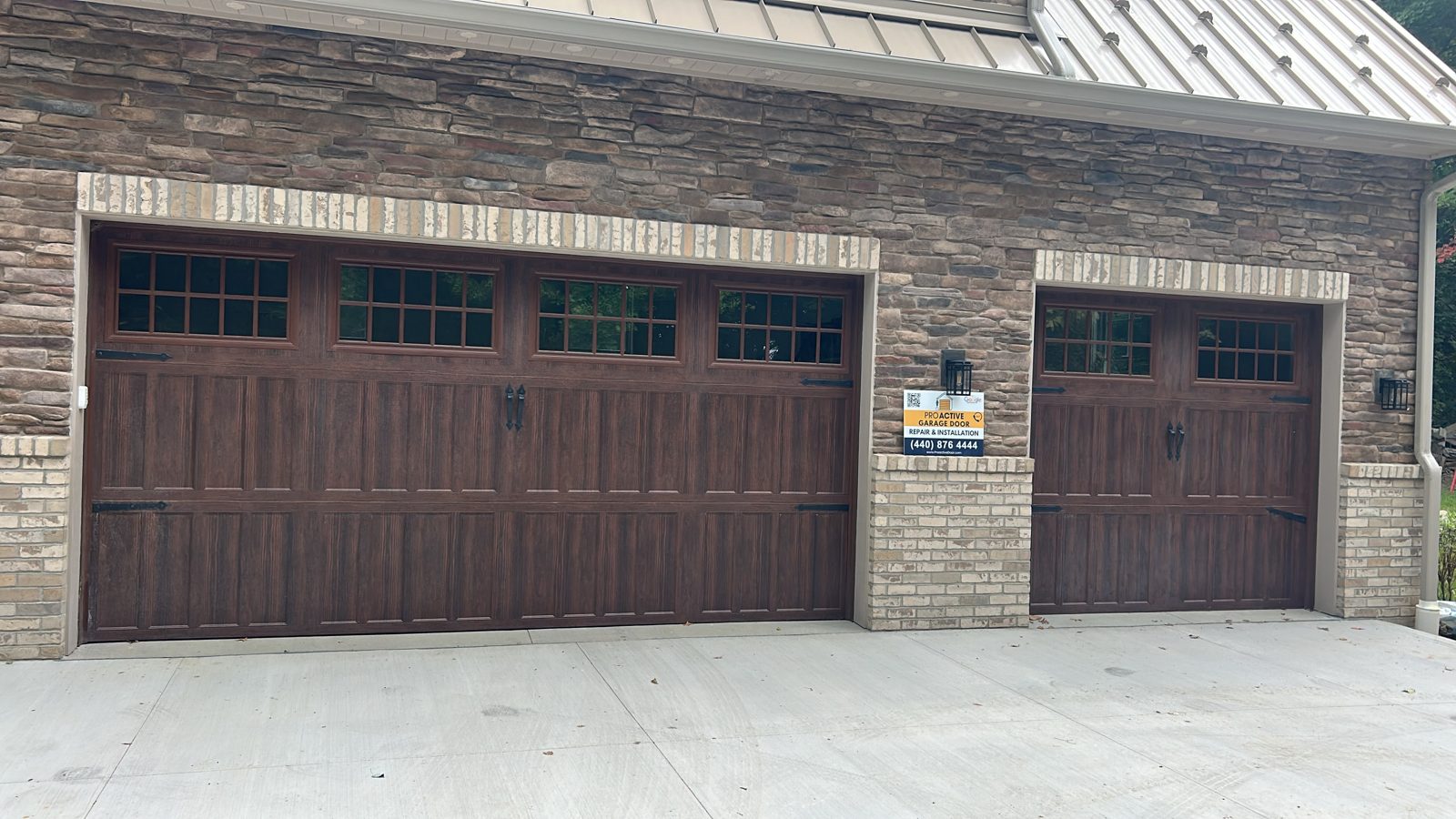 New carriage house garage doors installed by Proactive Garage Door Repair