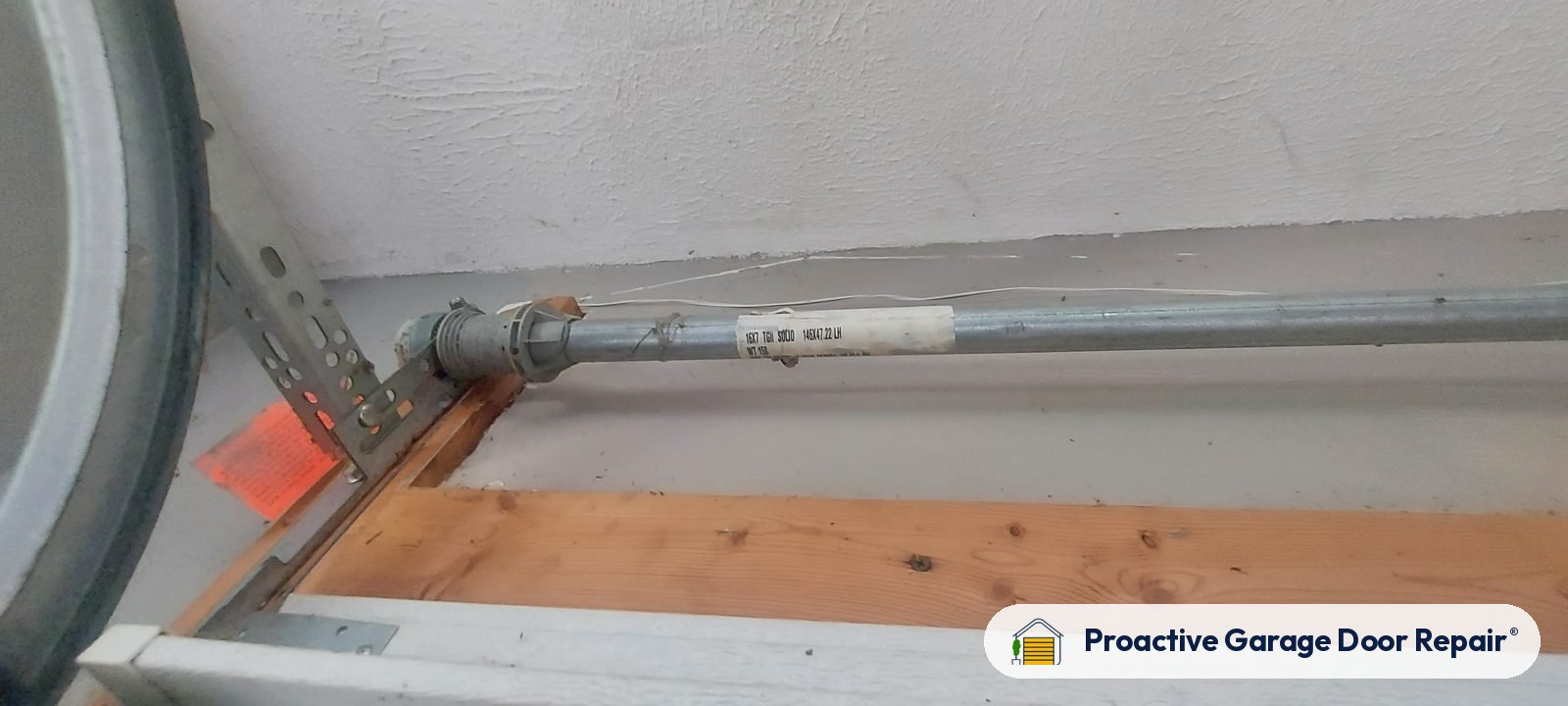 Commercial garage door cable and drum serviced by Proactive Garage Door Repair
