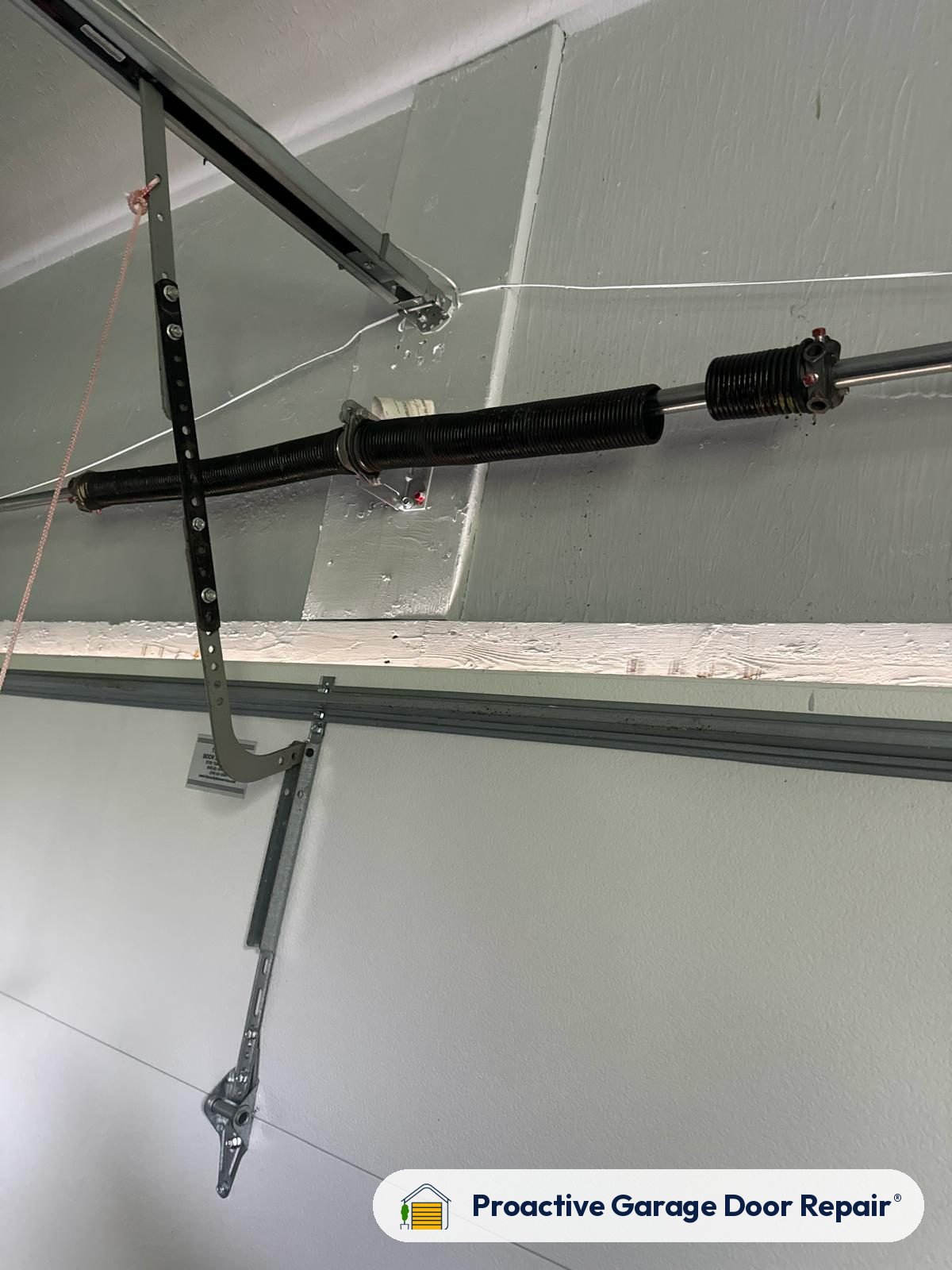 Garage door safety sensors aligned by Proactive Garage Door Repair
