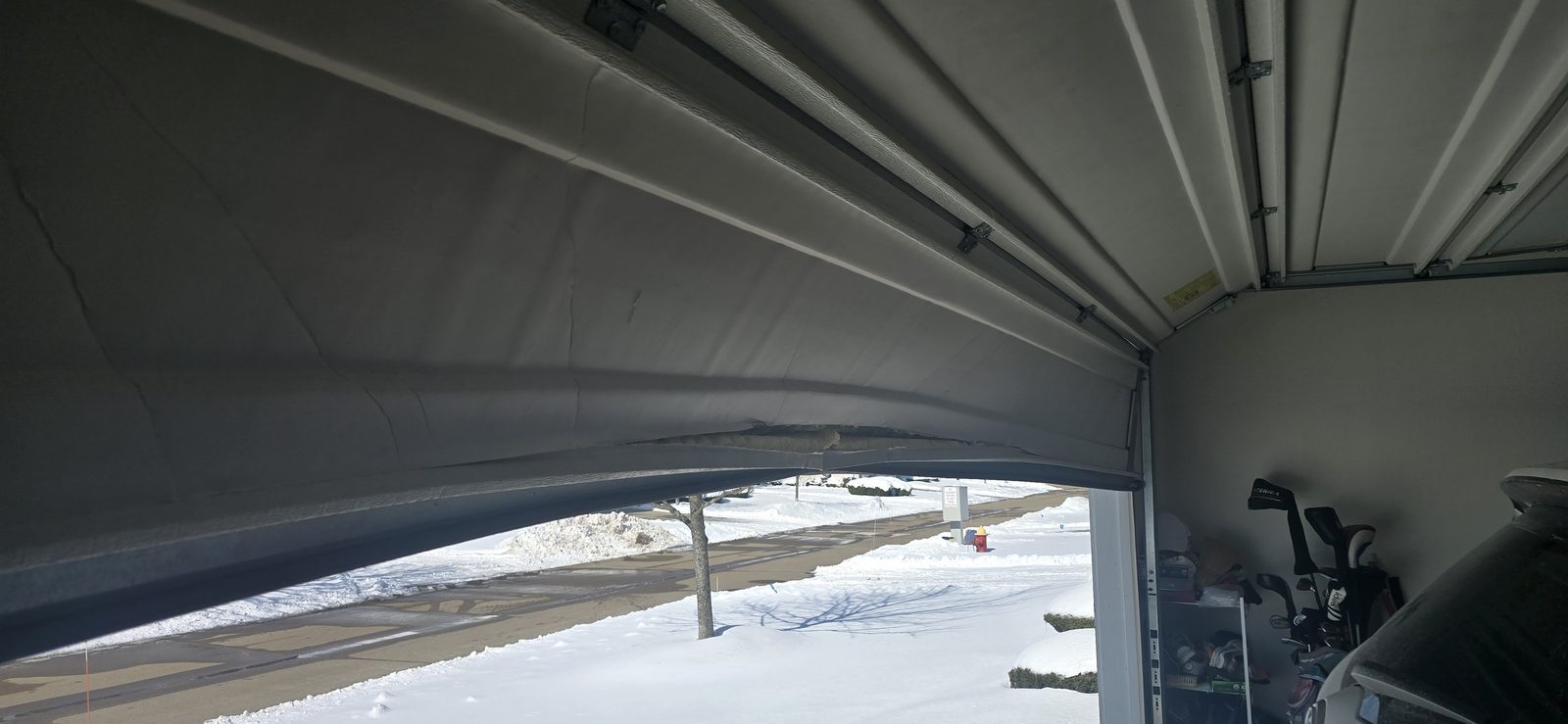 Damaged garage door before repair, photo 3