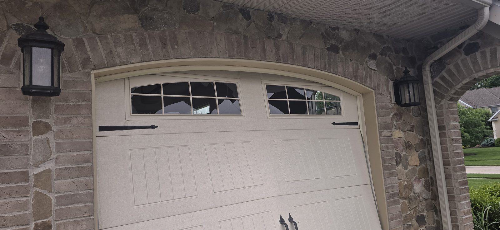Damaged garage door before repair, photo 5