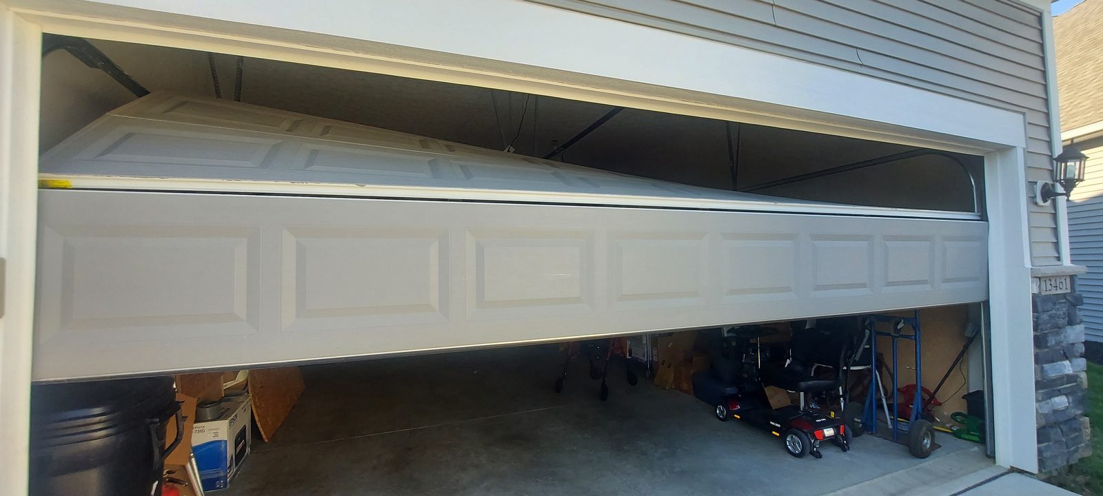 Damaged garage door before repair, photo 3