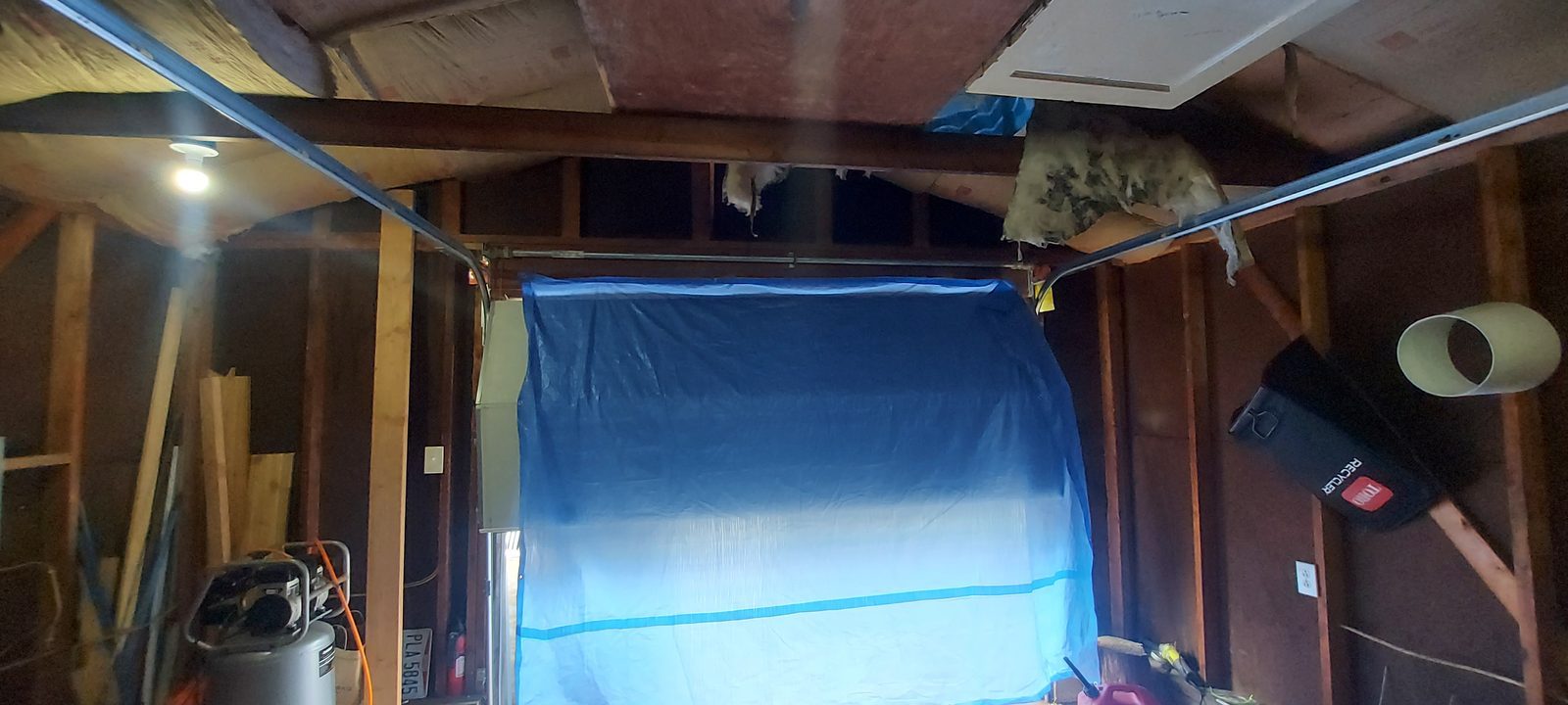 Damaged garage door before repair, photo 4