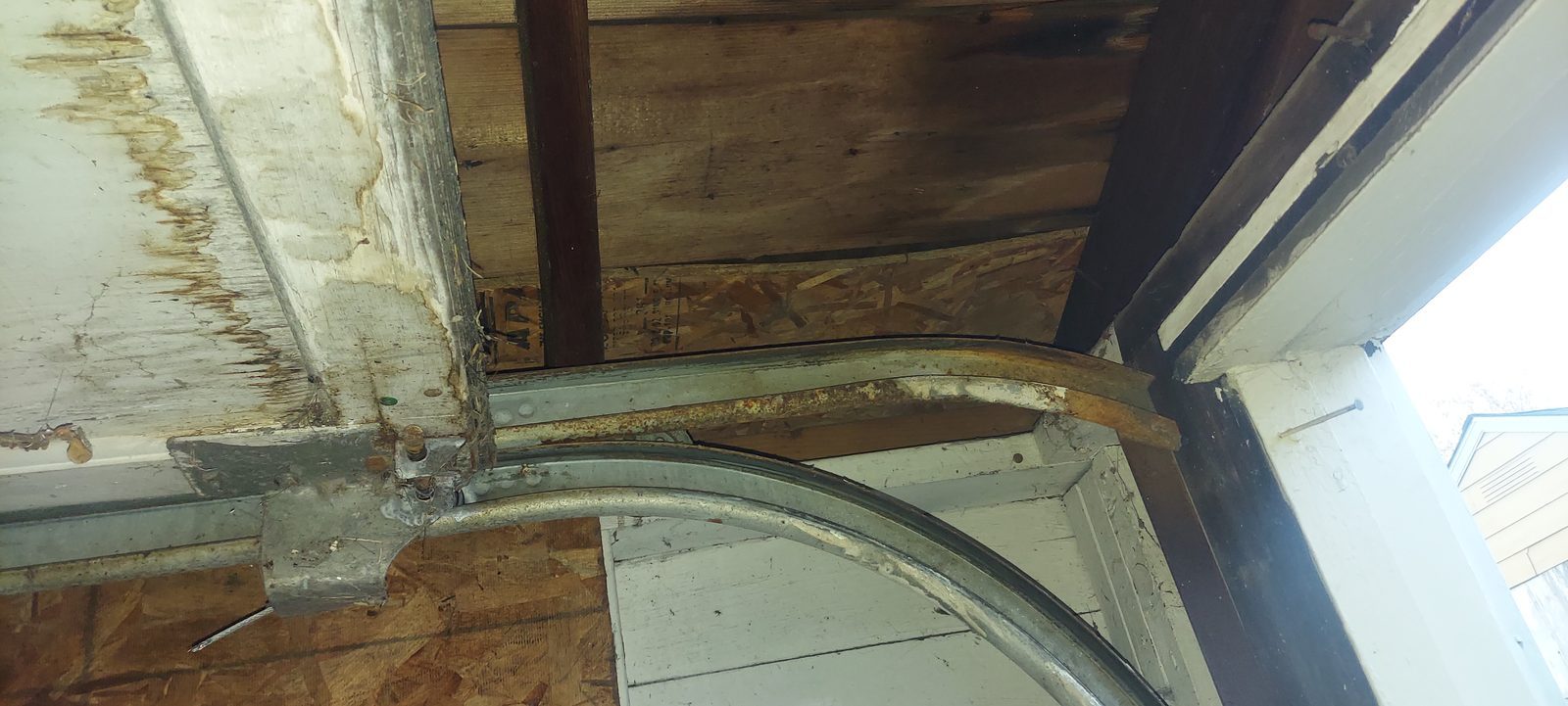 Damaged garage door before repair, photo 4