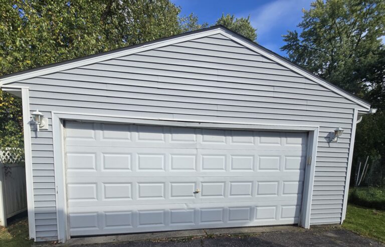 Dented double garage door before replacement