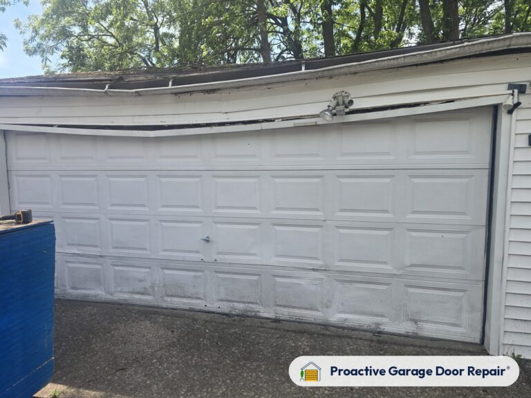 Damaged garage door before repair, photo 5