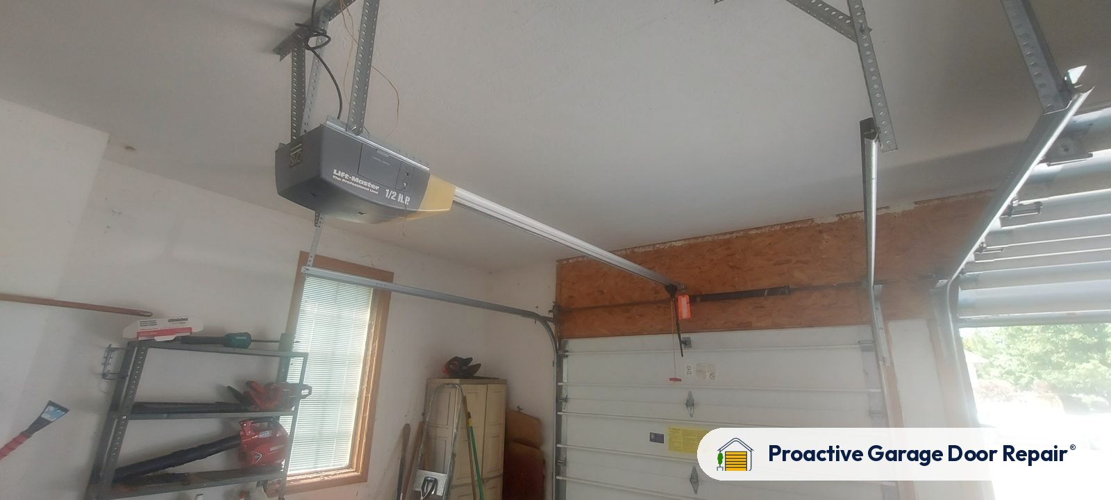 Garage door opener and rail in a customer garage, Proactive Garage Door Repair job