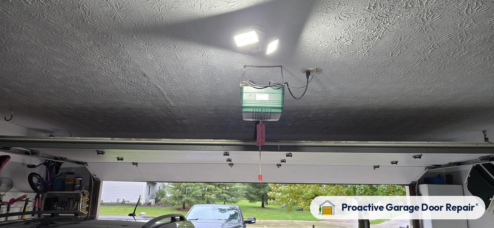 Garage door opener and rail in a customer garage, Proactive Garage Door Repair job, photo 2