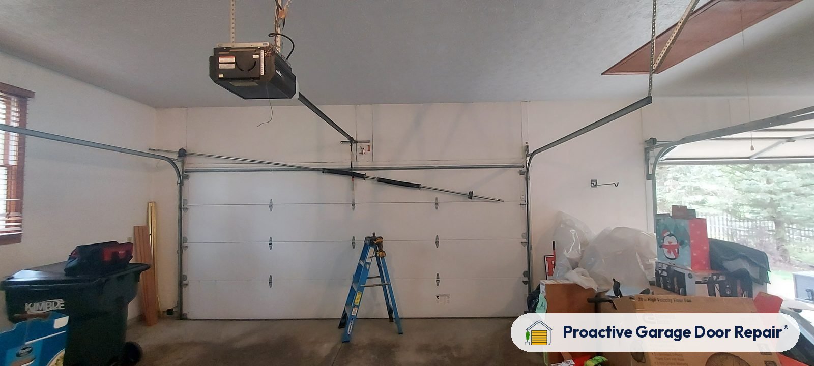 Garage door opener and rail in a customer garage, Proactive Garage Door Repair job