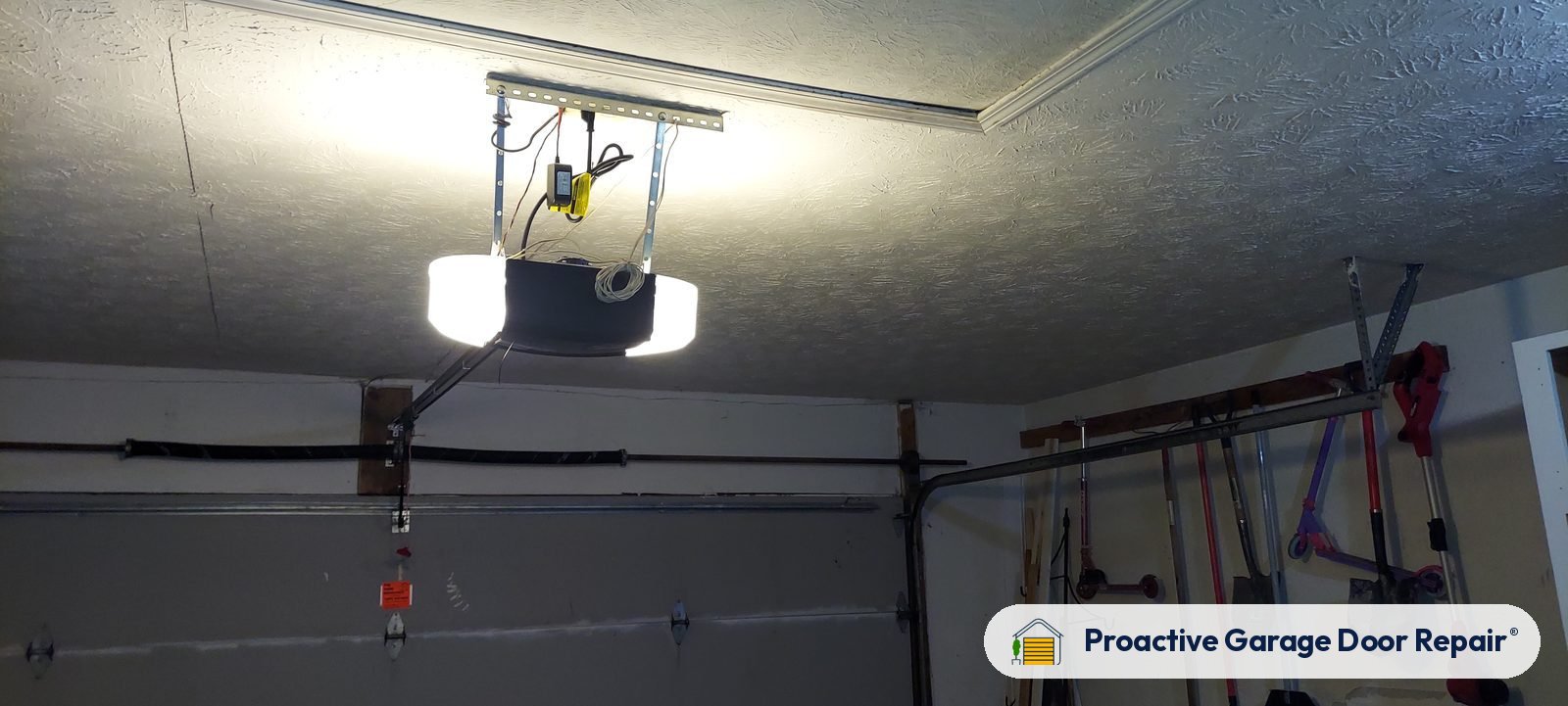 Garage door opener and rail in a customer garage, Proactive Garage Door Repair job, photo 2