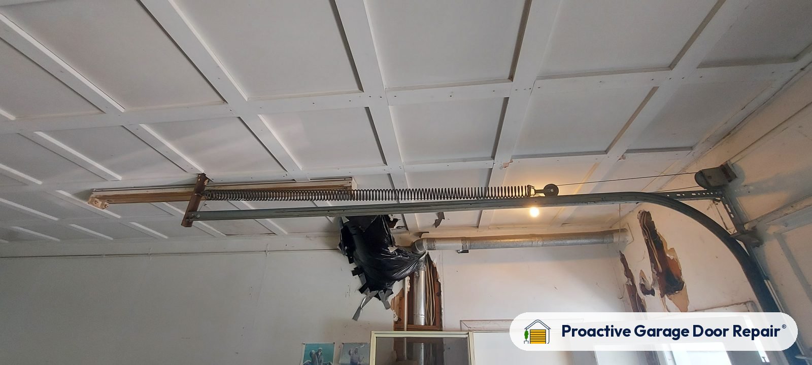 Garage door opener and rail in a customer garage, Proactive Garage Door Repair job