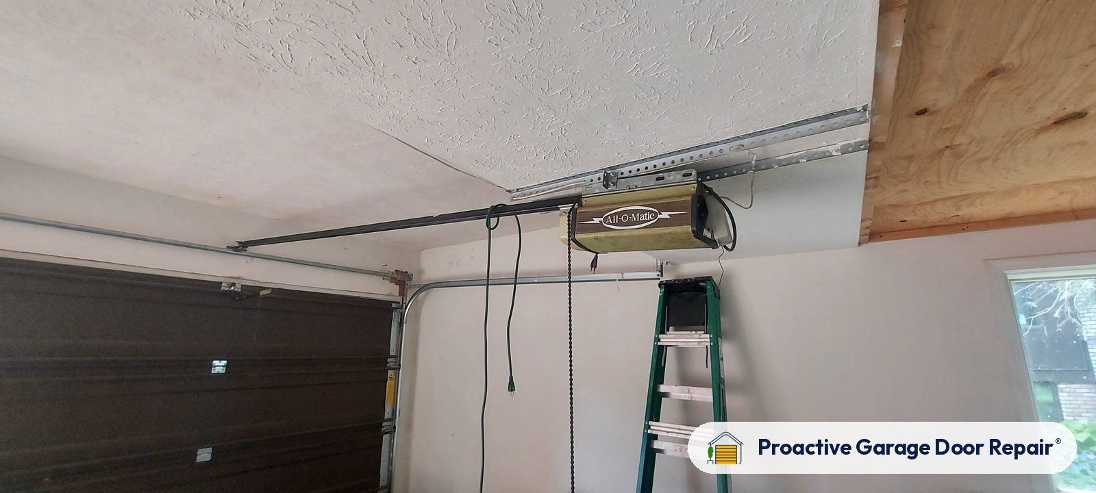Garage door opener and rail in a customer garage, Proactive Garage Door Repair job