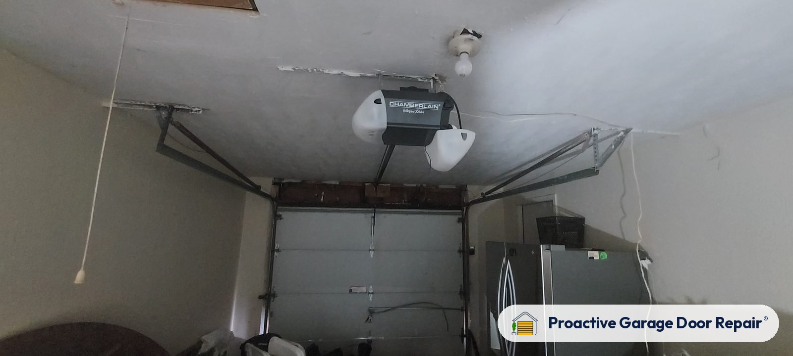 Garage door opener and rail in a customer garage, Proactive Garage Door Repair job