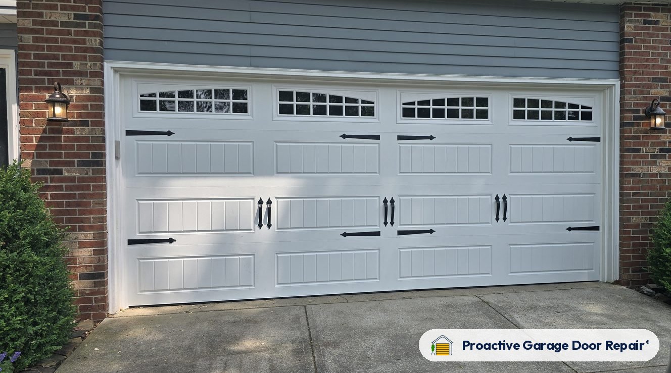 New white carriage-style double garage door with windows, installed in Medina County