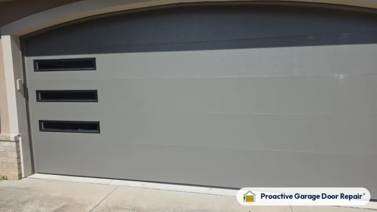 New gray modern garage door with long windows installed by Proactive Garage Door Repair
